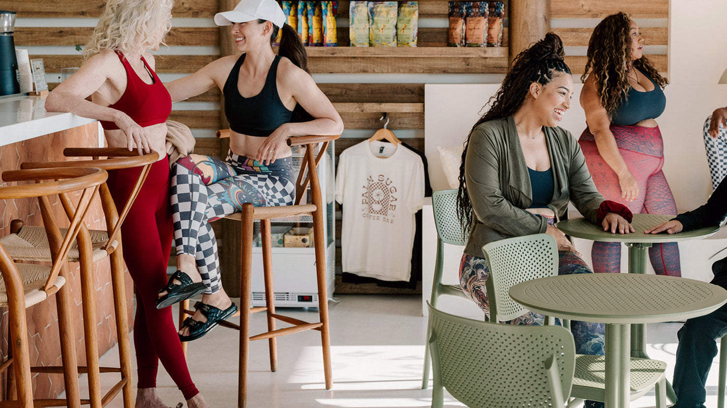 Group in athletic wear in coffee shop