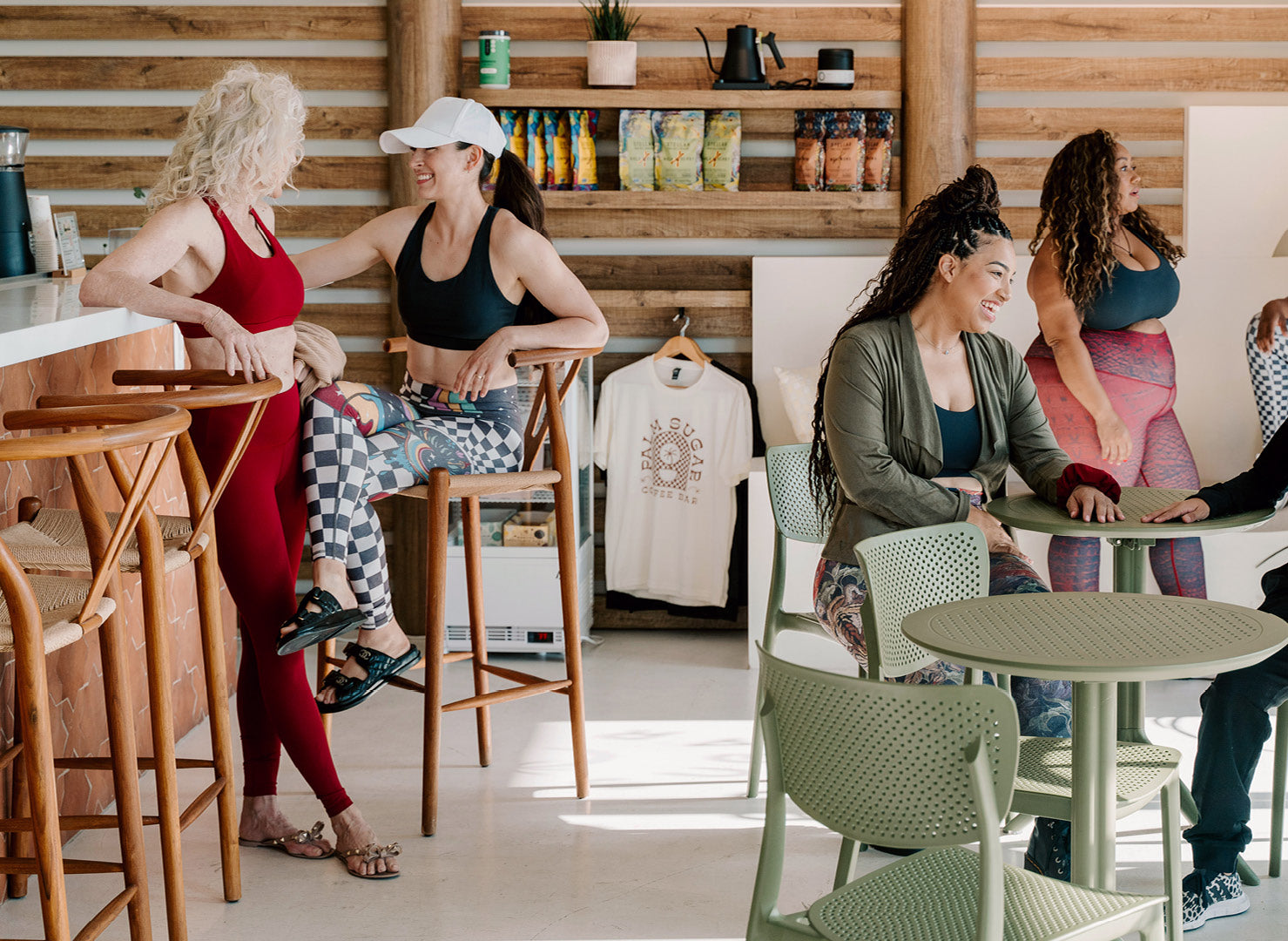 Group in athletic wear in coffee shop