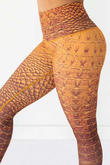 a person wearing a tight orange and brown pants