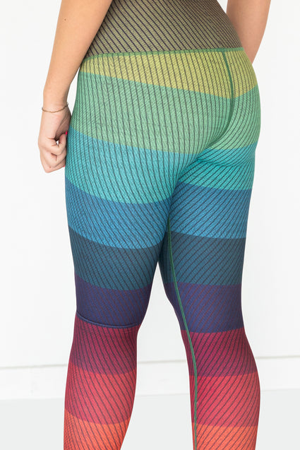 a person wearing a rainbow colored tights