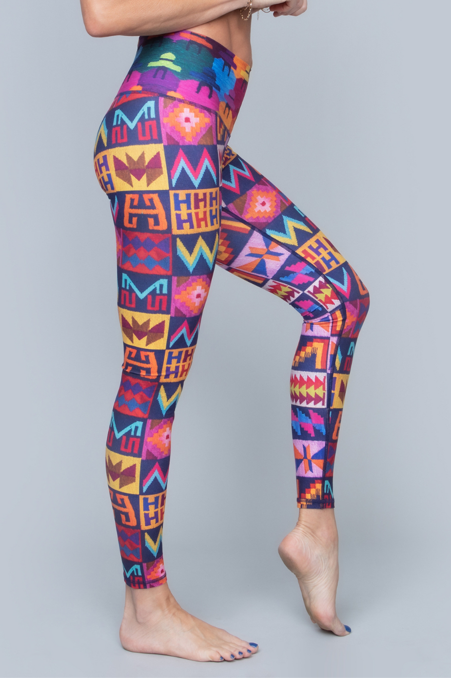 a woman wearing colorful leggings
